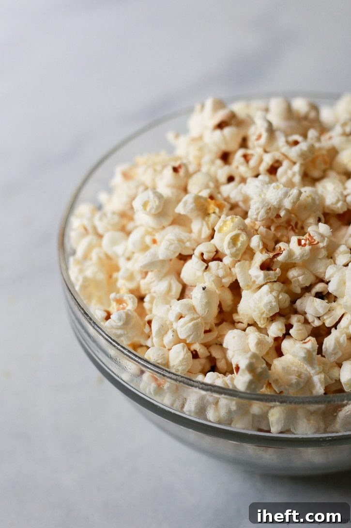 Homemade stovetop popcorn elevated with a sprinkle of luxurious truffle salt, creating an exquisite and sophisticated snack.