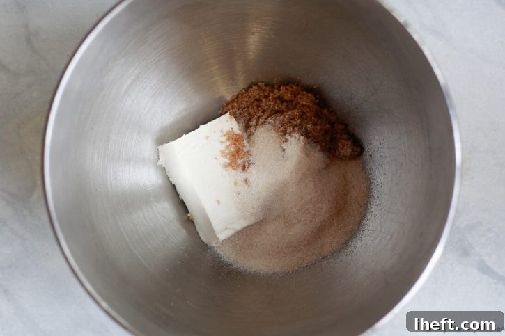Miyoko's vegan butter in a mixing bowl with brown and organic cane sugar, ready to be creamed.
