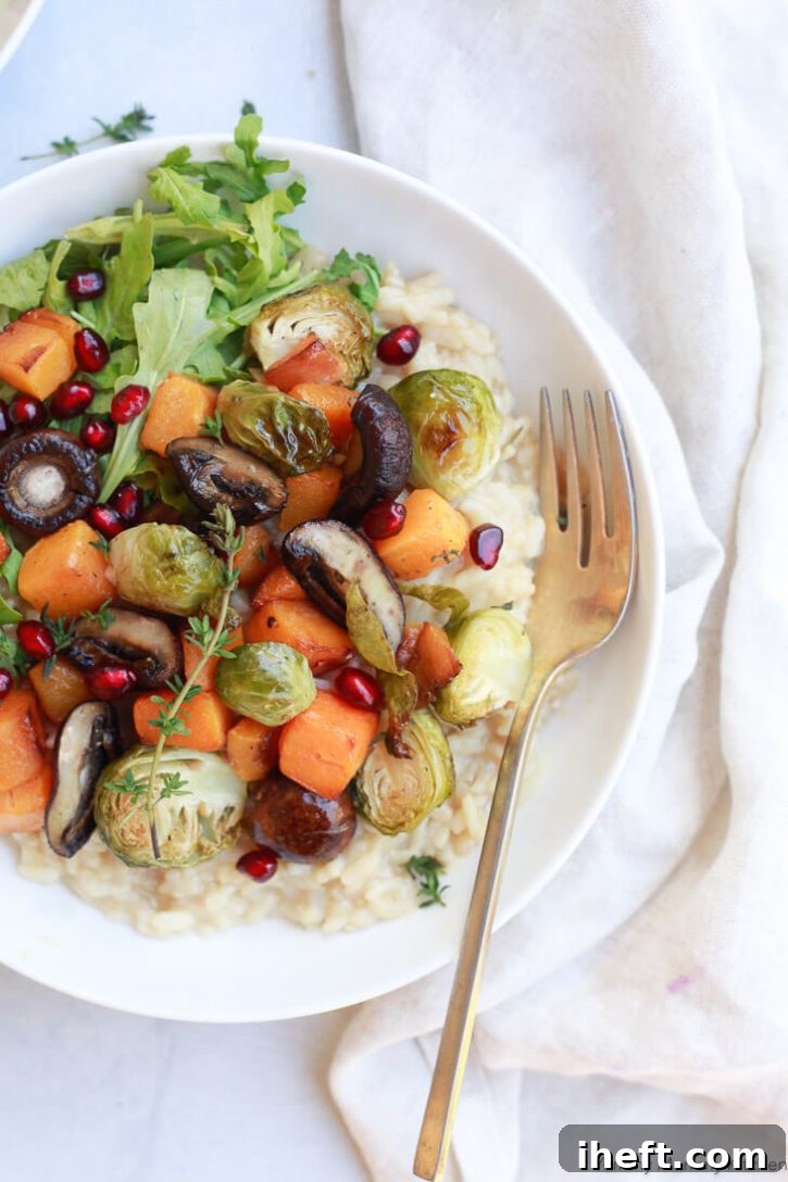 Vegan risotto topped with roasted brussels sprouts, butternut squash, and mushrooms. 