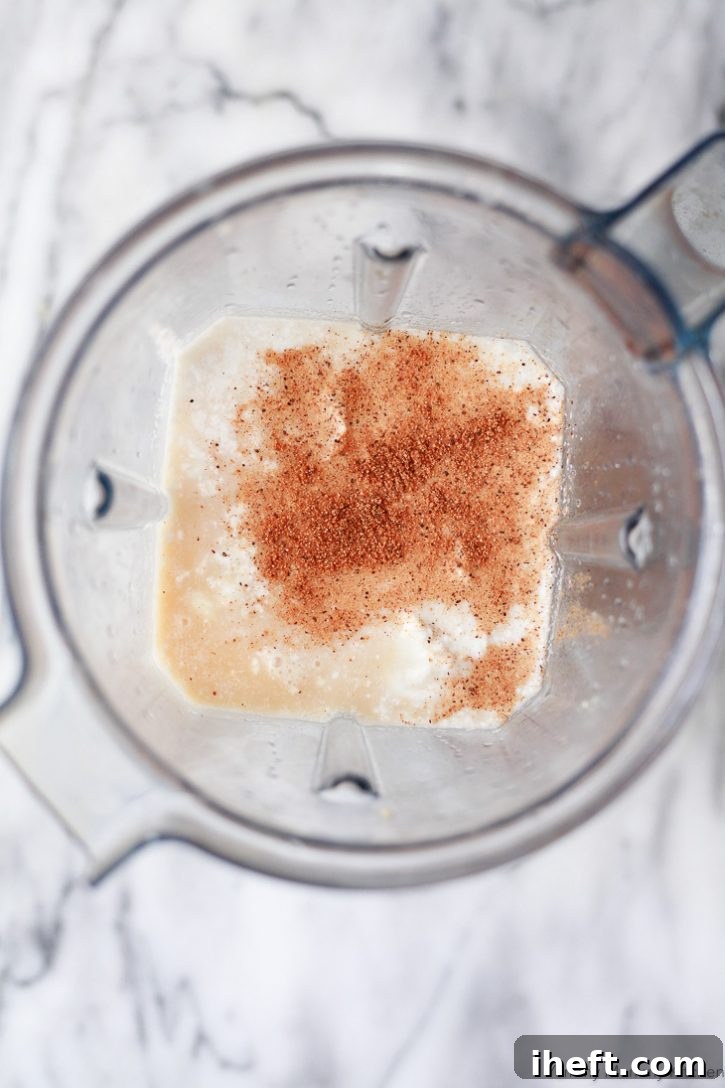Vegan eggnog ingredients in a Vitamix blender. 