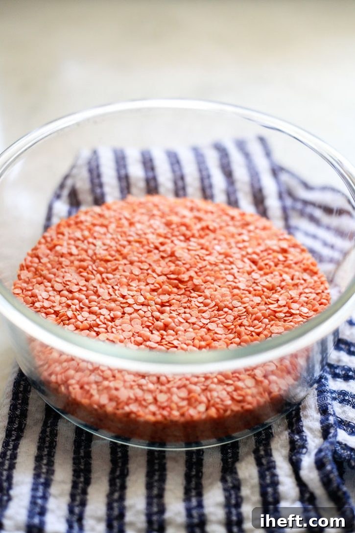 A bowl of dried red lentils.
