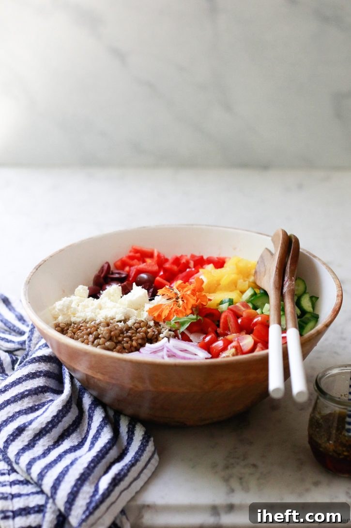 A beautiful colorful Mediterranean lentil salad in a wooden salad bowl. 