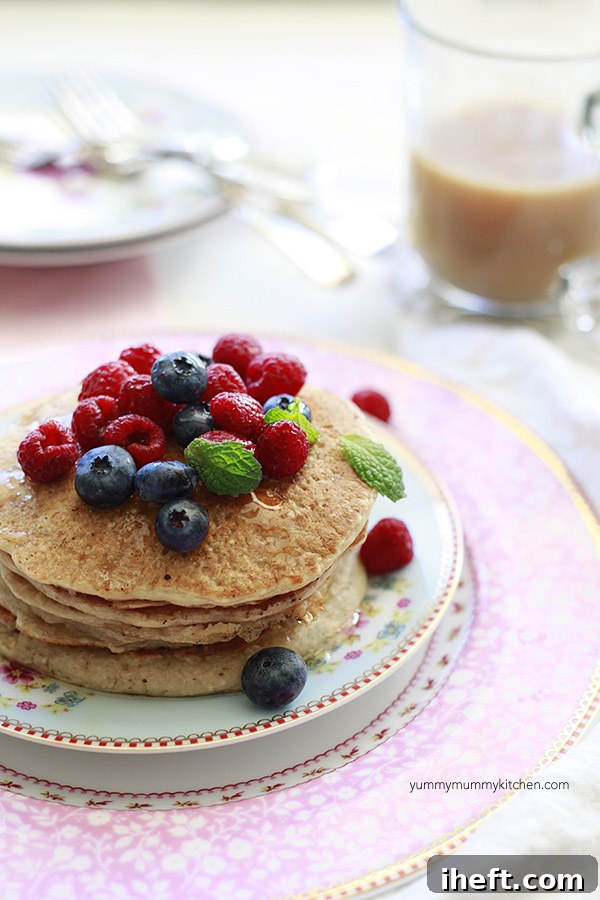 Fresh berries and agave syrup on protein oat pancakes