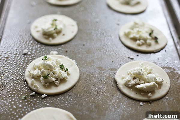 Ingredients laid out for beet and goat cheese puff pastry bites, including fresh thyme, goat cheese, and raw puff pastry.