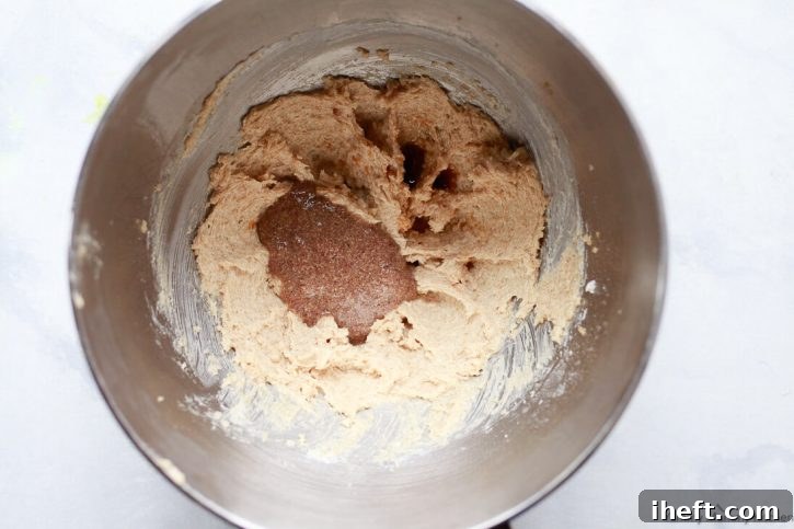 The wet ingredients for gluten free vegan oatmeal cookies in the bowl of a mixer. 