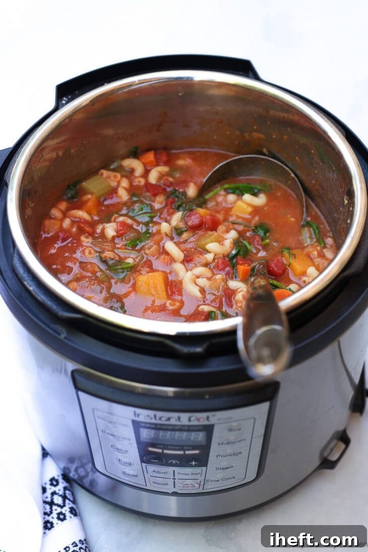 An Instant Pot pressure cooker filled with a vegan Minestrone soup. 