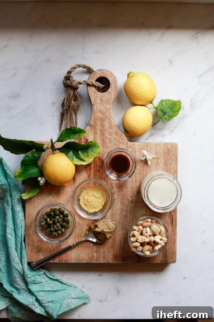 A selection of fresh ingredients for vegan Caesar salad dressing is artfully arranged on a rustic wooden cutting board, displayed in small, elegant bowls. The scene features plump, soaked cashews, bright almond milk, a bottle of vegan Worcestershire sauce, freshly squeezed lemon juice, golden nutritional yeast flakes, and a scattering of briny capers, all essential components for crafting this delicious plant-based dressing. A hint of garlic is missed but implied for classic flavor.