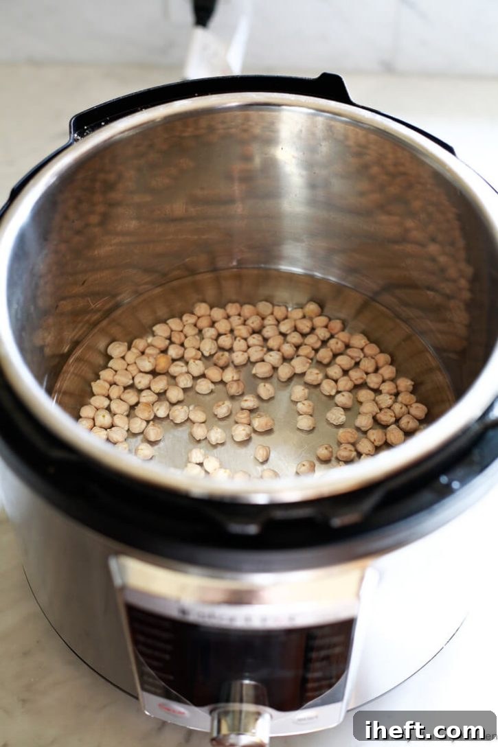 Dried chickpeas and water in an Instant Pot Ultra pressure cooker before cooking. 