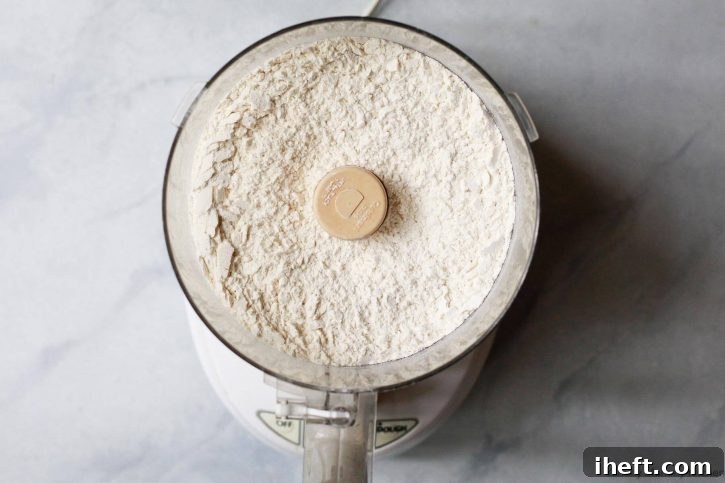 Flour and salt in the bowl of a food processor.