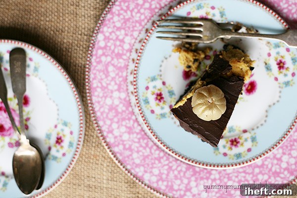 Overhead view of a whole Chocolate Pumpkin Cheesecake adorned with white chocolate pumpkins