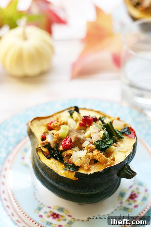 A close-up shot of roasted acorn squash stuffed with a savory and sweet filling, garnished with fresh herbs.