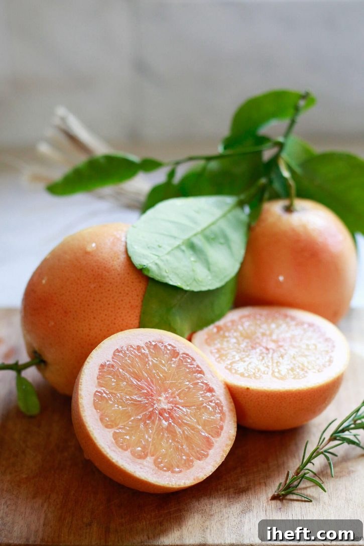 Freshly picked grapefruit on a cutting board to make greyhound drinks. 