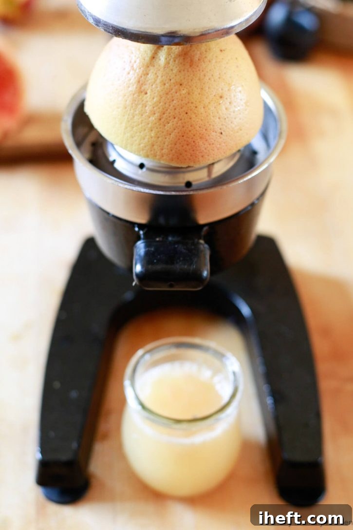 Grapefruits are pressed using a citrus press. 
