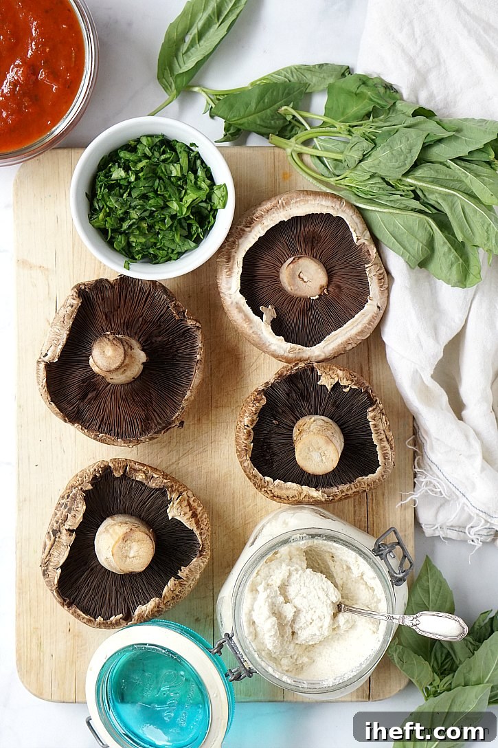 Just a few simple ingredients are needed for this vegan stuffed portobello recipe. Portobellos, marinara, fresh spinach and basil, and almond ricotta.