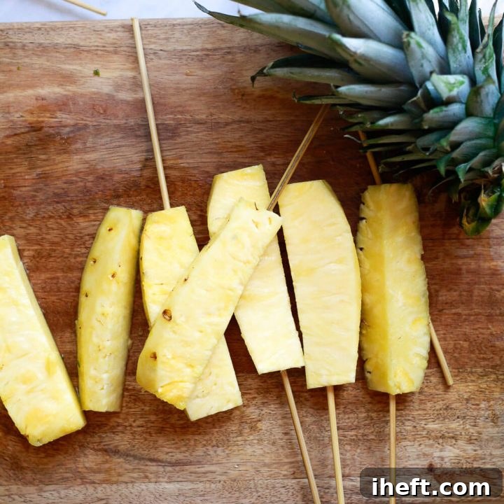 Beautifully prepared pineapple spears, glistening and ready to enjoy.