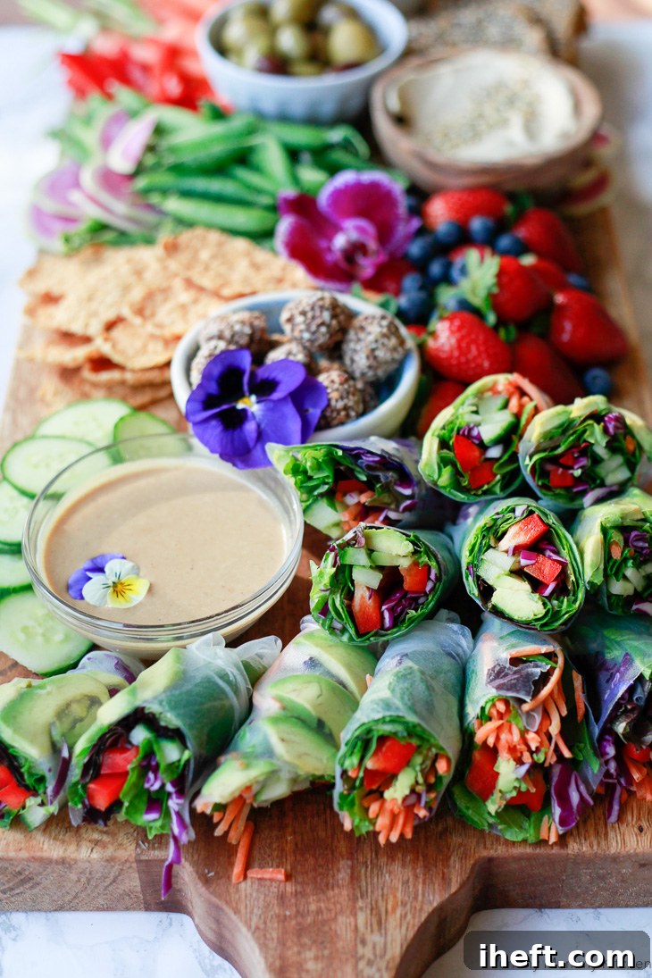 Fresh vegetarian and vegan spring rolls made with rice paper, avocado, bell pepper, and other veggies. Served with homemade peanut sauce, this spring roll recipe is so delicious.