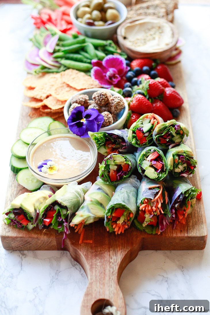 Colorful fresh homemade spring rolls served with peanut sauce are perfect on a party platter, for lunch, or a light dinner.