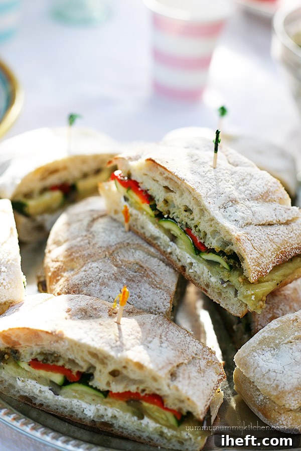 Close-up of a roasted vegetable and goat cheese sandwich.