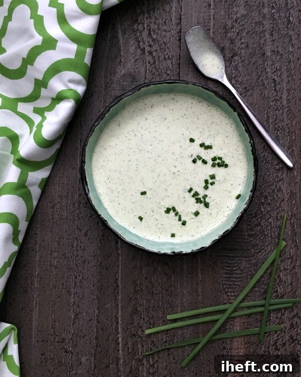 Fresh Celery Ranch Dressing in a jar with celery sticks.