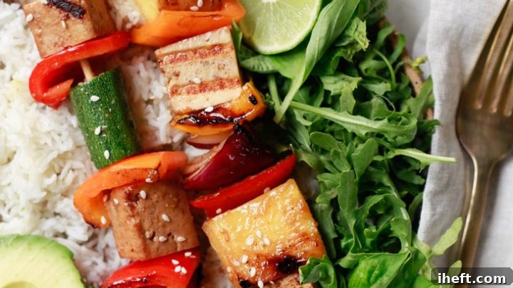Colorful vegetable and tofu kabobs ready for grilling