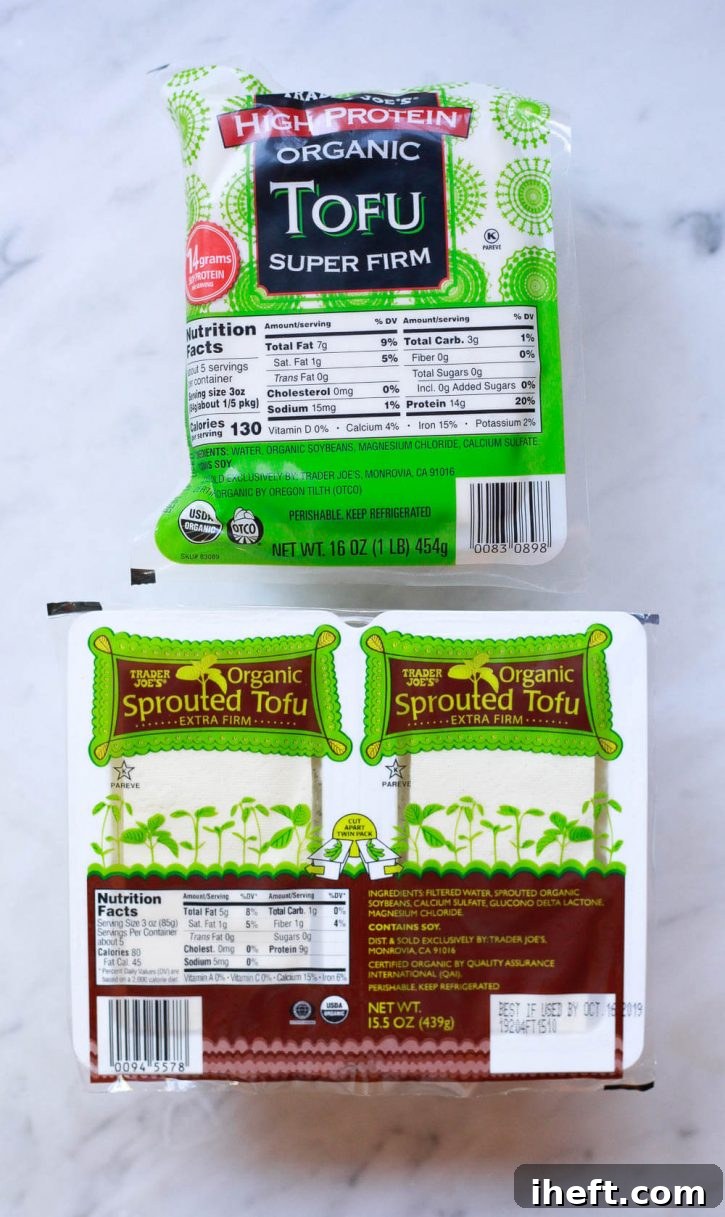 Two packages of Trader Joe's organic tofu: Organic High Protein Super Firm Tofu and Sprouted Organic Tofu, illustrating different types of tofu available in stores.