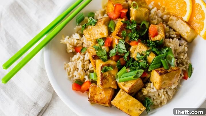 Vibrant orange tofu dish, likely made with an EZ Tofu Press