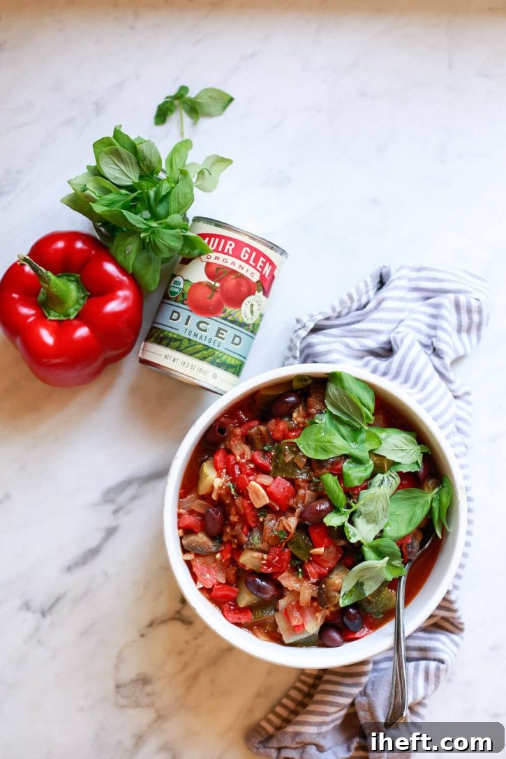 A rich, rustic bowl of traditional ratatouille, showcasing the comforting simplicity of the French vegetable stew.