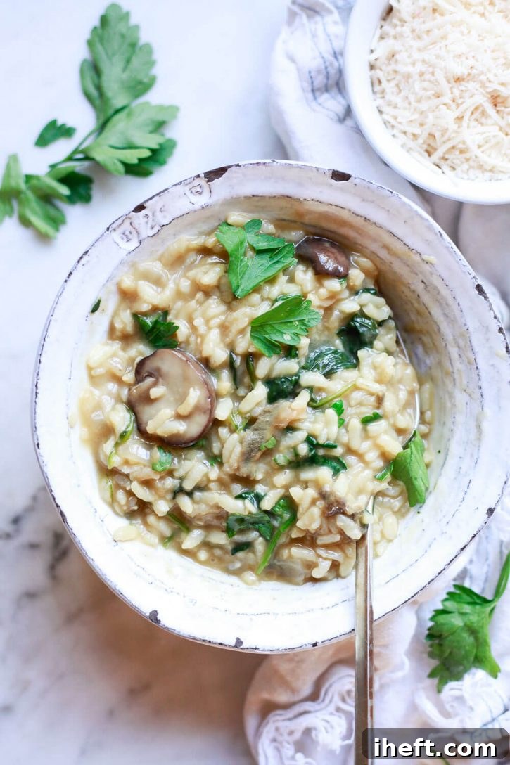 A beautifully plated bowl of creamy mushroom risotto garnished with fresh herbs.