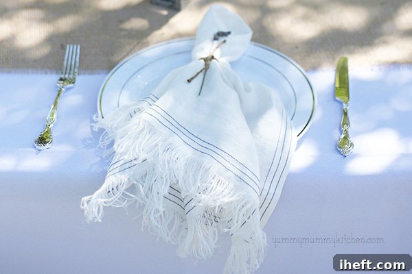 Close-up of a place setting with linen napkin and lavender