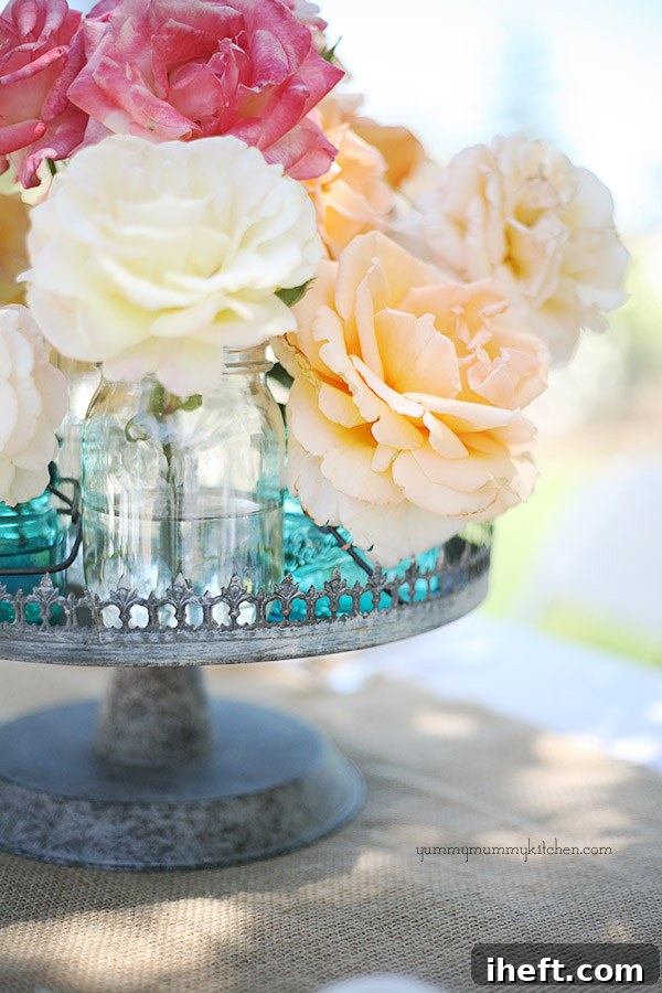 Aidan Gray Decor Metal Plate Stand centerpiece with roses