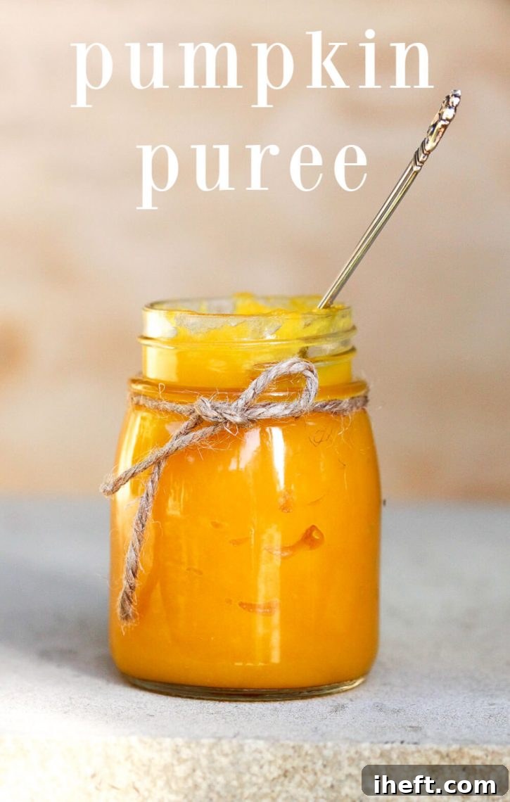 A glass jar filled with homemade pumpkin puree. How to make pumpkin puree for pie, baked goods, and more. How to cook pumpkin, and pumpkin puree recipes.