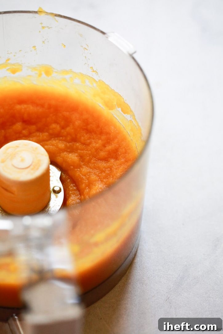 Fresh pumpkin purees in a food processor. How to cook pumpkin for pie. 
