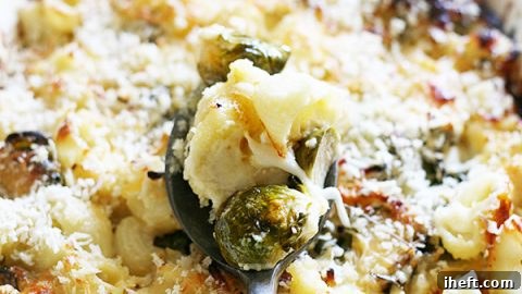 Warm and creamy baked mac and cheese filled with roasted Brussels sprouts for a delicious comfort food vegetarian dinner.