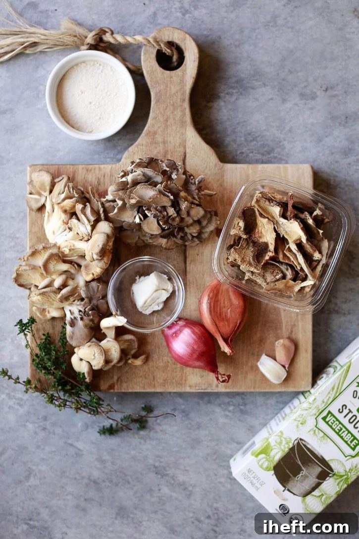 A vibrant array of ingredients for vegan mushroom gravy laid out on a wooden cutting board, including fresh wild mushrooms, dried porcini, shallots, garlic, vegan butter, flour, and vegetable stock, ready for preparation.