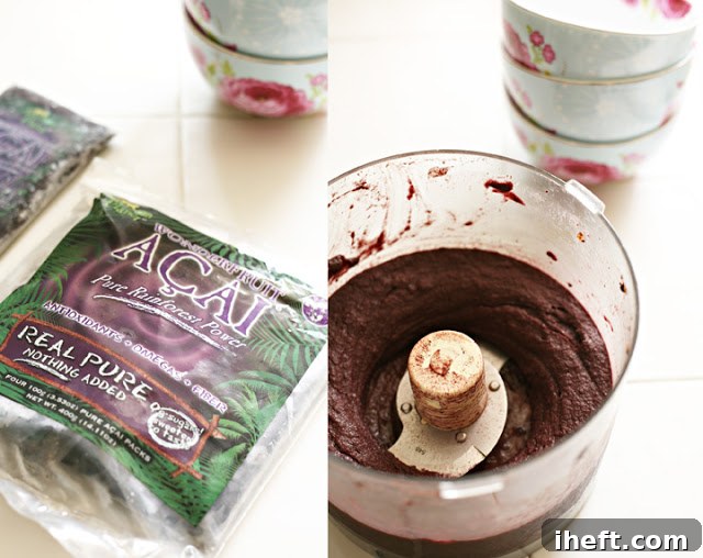 Frozen acai smoothie packs blending in a food processor.