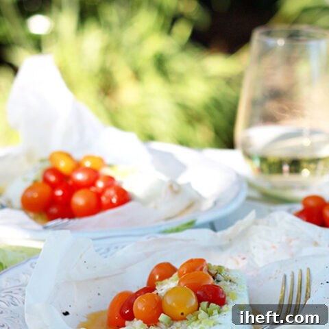 Parchment Papillote packets with halibut, lemongrass and cherry tomatoes.