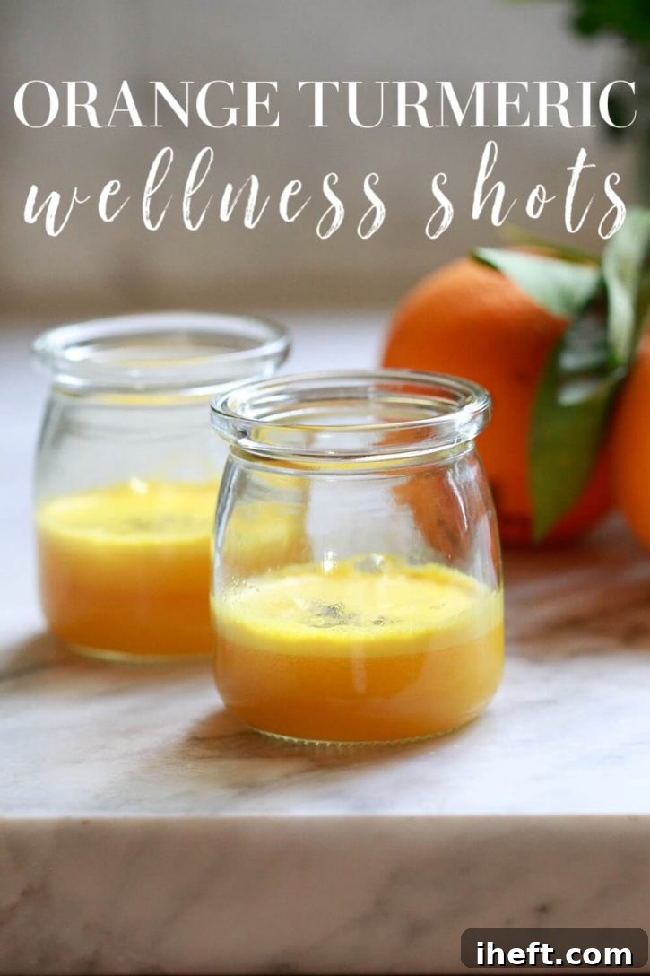 Two vibrant homemade orange turmeric shots artfully arranged on a sleek kitchen countertop, ready to be enjoyed. Discover how to effortlessly create your own potent turmeric wellness shots at home.
