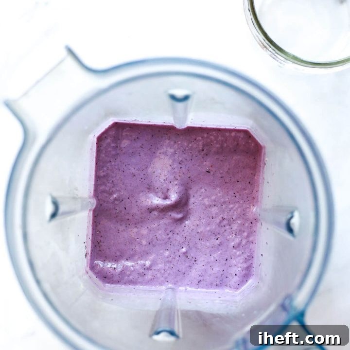A beautifully presented Blueberry Chia Seed Smoothie in a glass, ready to drink.