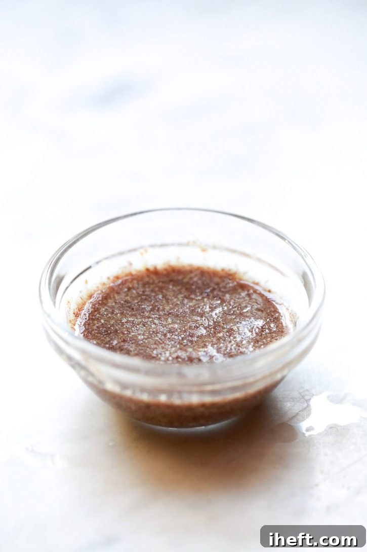 A perfectly gelled flax egg in a small bowl, showcasing its ready-to-use consistency for vegan baking.