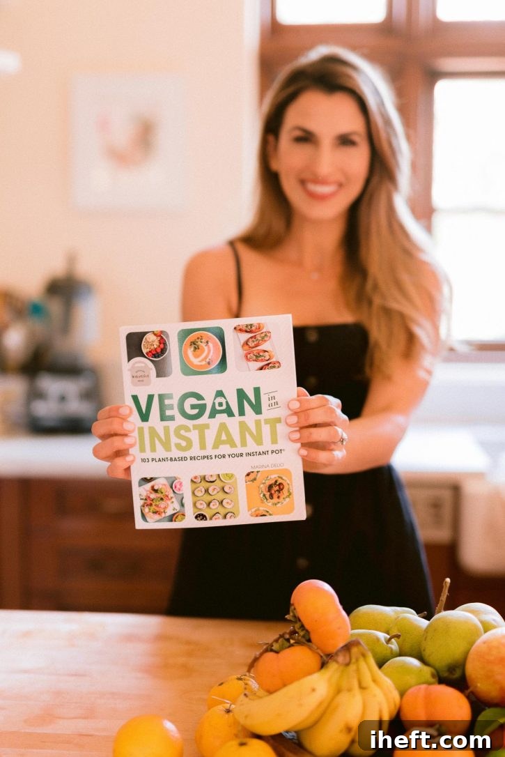 A cookbook author, Marina Delio, holds a copy of 'Vegan in an Instant', a healthy vegetarian and vegan Instant Pot cookbook.