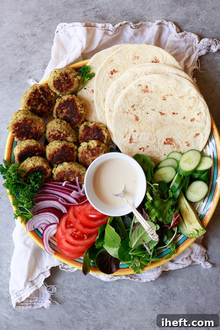 A delicious falafel wrap filled with fresh vegetables and tahini sauce.