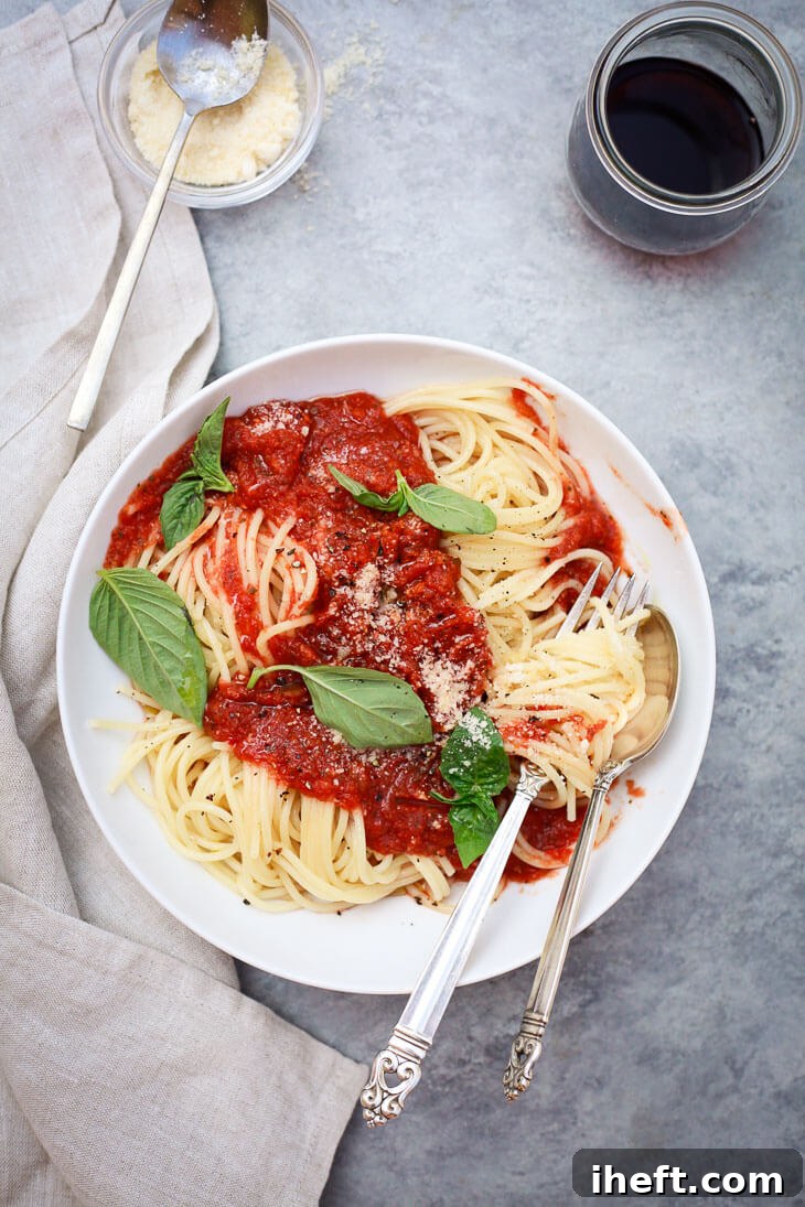 A rich, homemade pomodoro sauce simmering in a pan, ready for pasta.