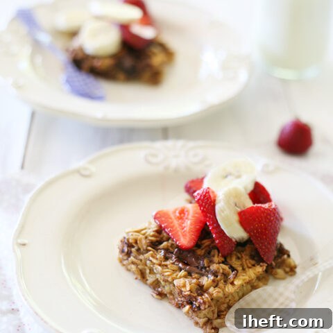 A square of nutella baked oatmeal topped with strawberries.