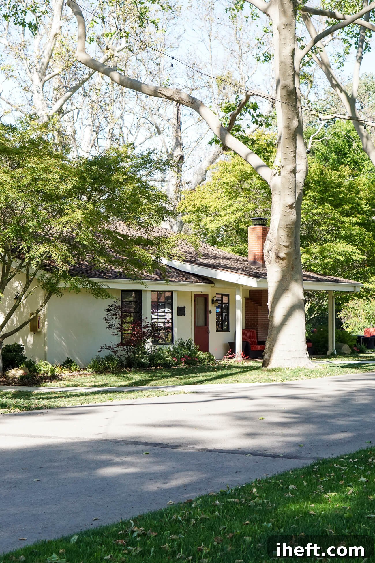A charming white cottage along the driveway at Alisal Guest Ranch, a luxury dude ranch in California. 