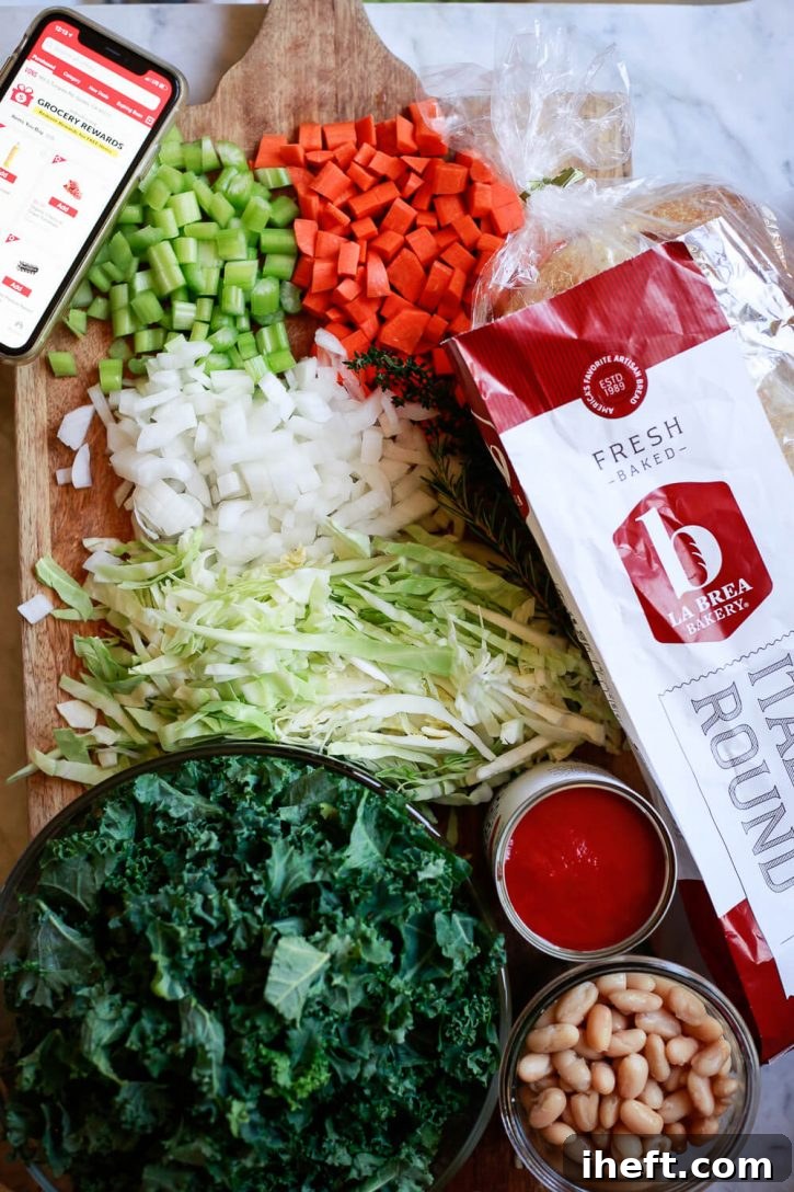 Fresh, wholesome ingredients for Tuscan Ribollita soup meticulously arranged on a rustic wooden cutting board, showcasing the natural beauty of vegetables, beans, and herbs.