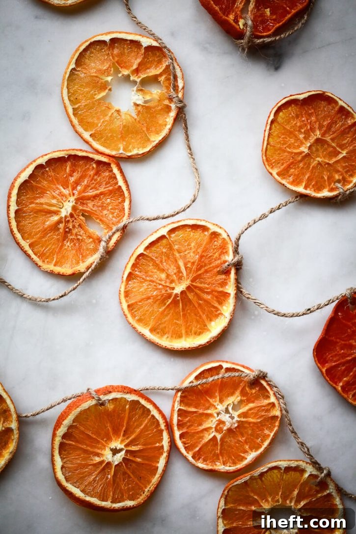Dried orange slices are strung on twine to make a Christmas garland.