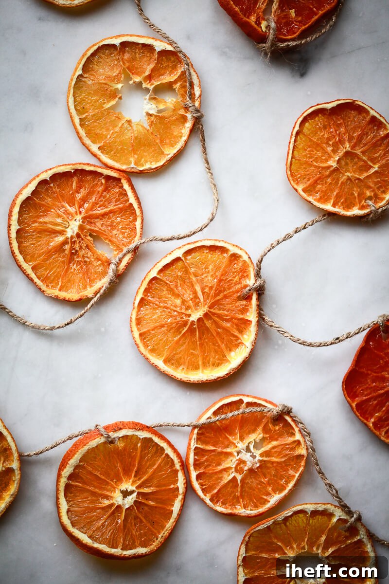 Dried orange slices threaded on a piece of twine to create an orange garland.