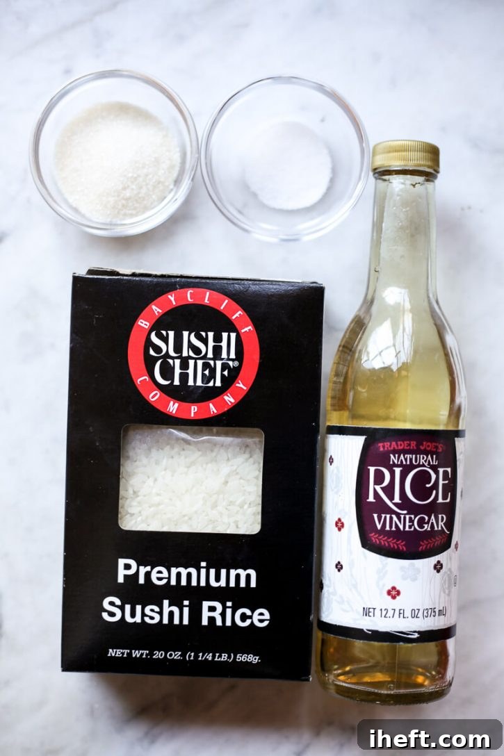 Sushi rice, rice vinegar, sugar, and salt on a kitchen counter. These are the ingredients for making sushi rice at home. 