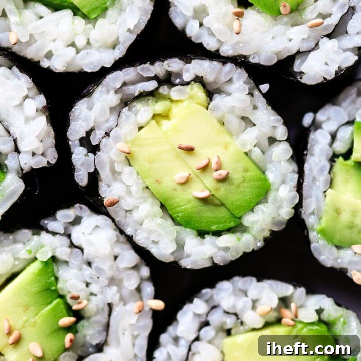 A close up photo of avocado sushi to show of perfect sushi rice made at home in the Instant Pot.