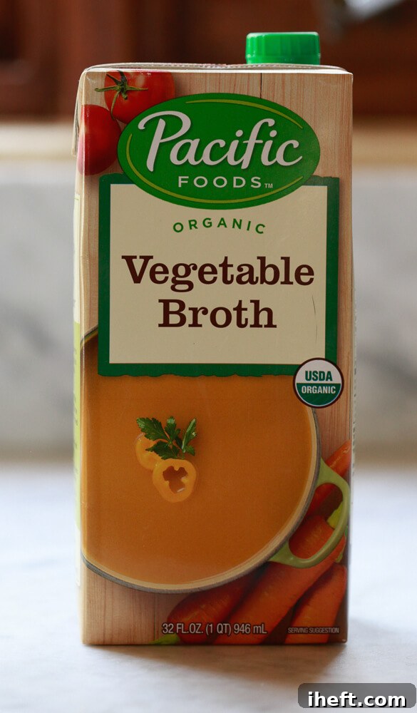 A 32 oz. (1 quart) box of vegetable broth on a kitchen counter to illustrate the size of a quart. 